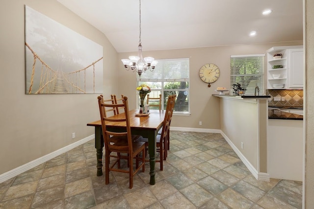 tiled dining area with a chandelier