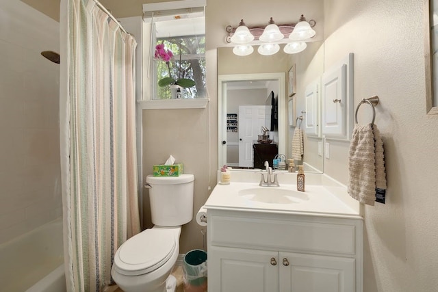 full bathroom featuring toilet, oversized vanity, and shower / tub combo