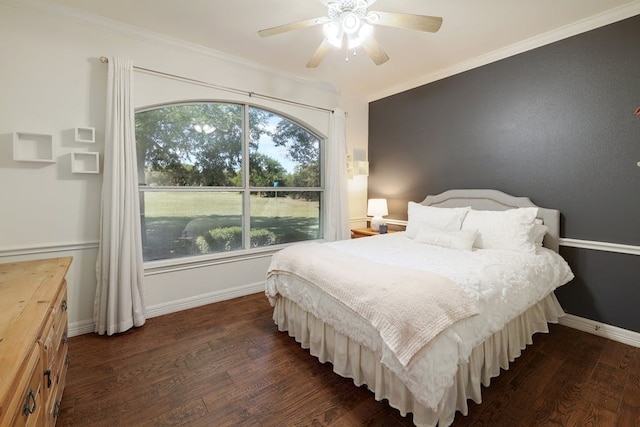 bedroom featuring crown molding, ceiling fan, and dark wood-type flooring