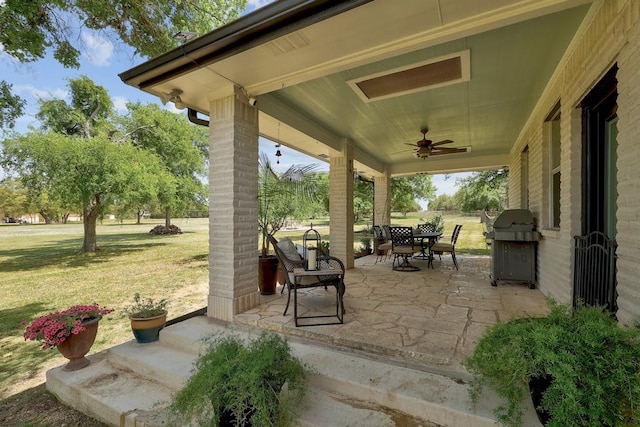 view of patio / terrace featuring ceiling fan