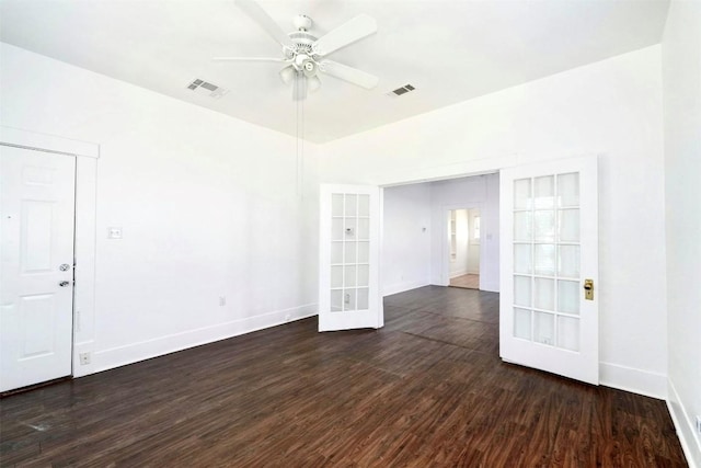 unfurnished room with ceiling fan, dark hardwood / wood-style flooring, and french doors