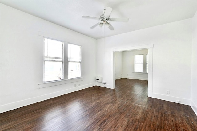 unfurnished room featuring ceiling fan and dark hardwood / wood-style floors