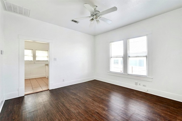 unfurnished room featuring hardwood / wood-style floors and ceiling fan