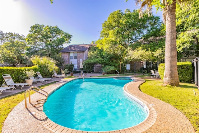 view of swimming pool with a patio area