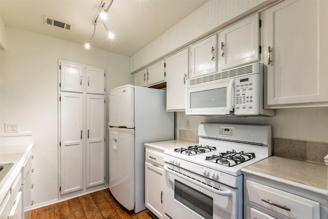 kitchen featuring track lighting, white appliances, dark hardwood / wood-style floors, and white cabinetry