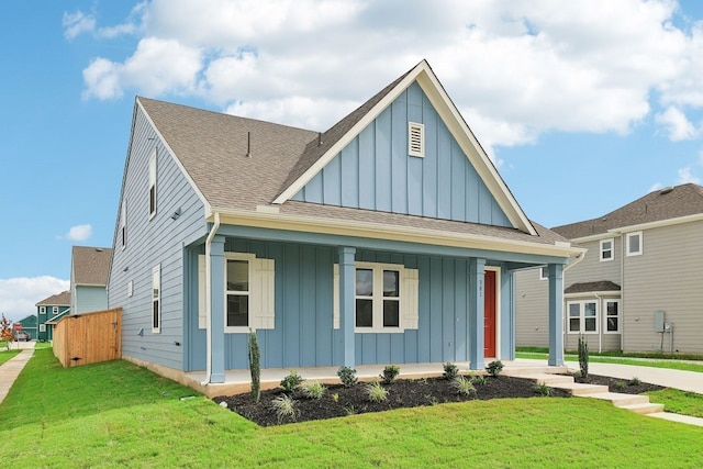 view of front facade with a front yard and a porch