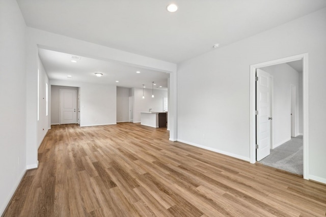 unfurnished living room with light hardwood / wood-style flooring