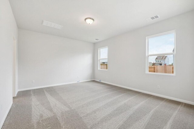 unfurnished room featuring carpet flooring