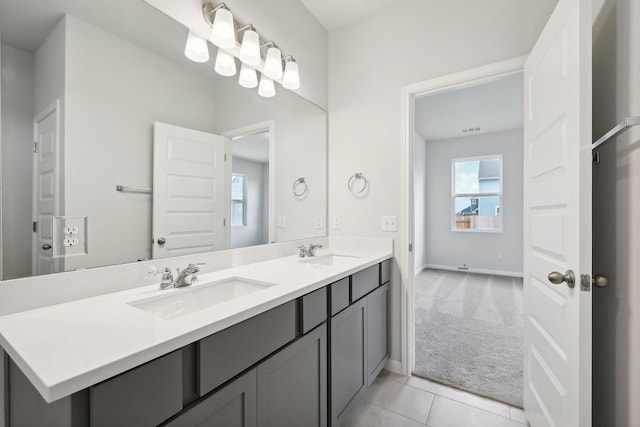 bathroom with tile patterned floors and vanity