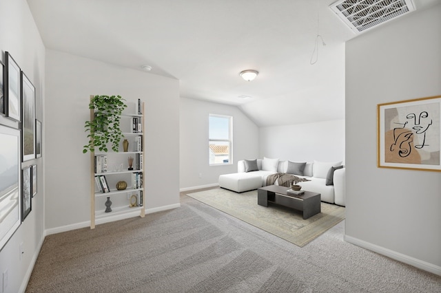 carpeted living room featuring lofted ceiling