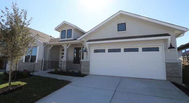 craftsman-style house featuring a porch and a garage