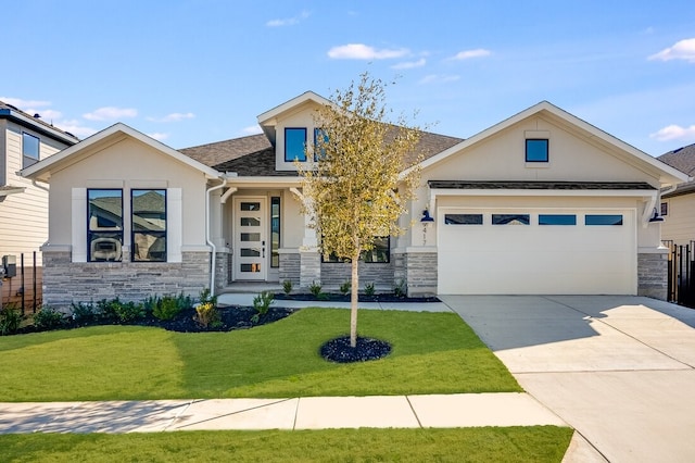 craftsman-style home featuring a garage and a front lawn