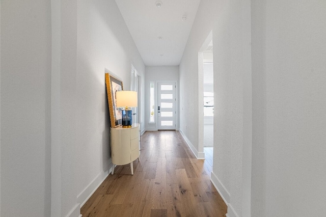 corridor with wood-type flooring