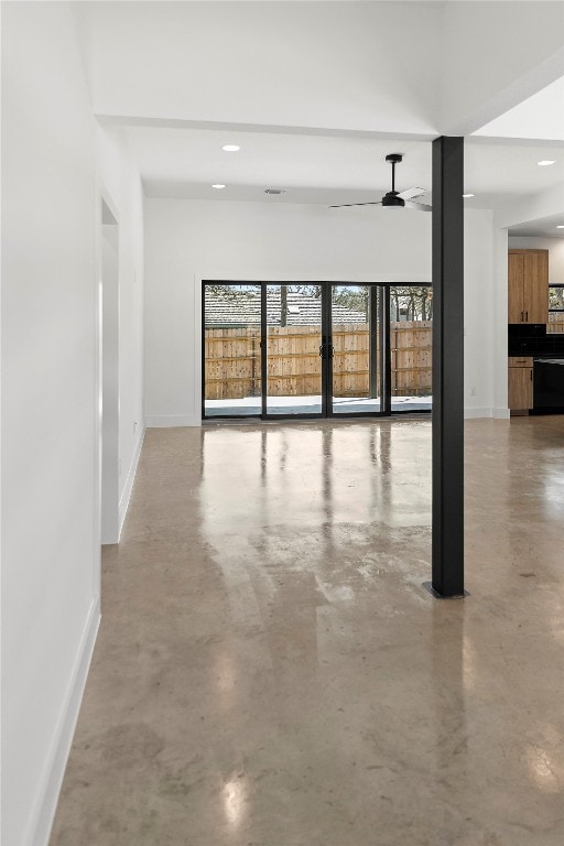 interior space with ceiling fan