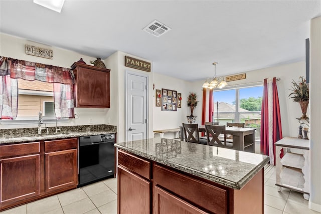 kitchen featuring sink, decorative light fixtures, a chandelier, a center island, and dishwasher