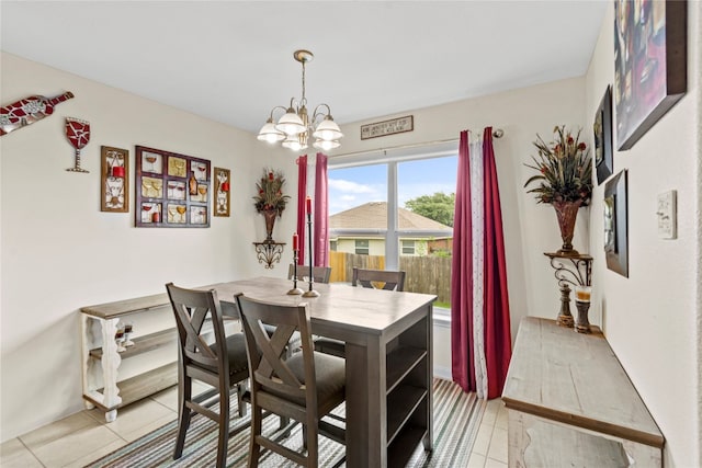 tiled dining area with a notable chandelier