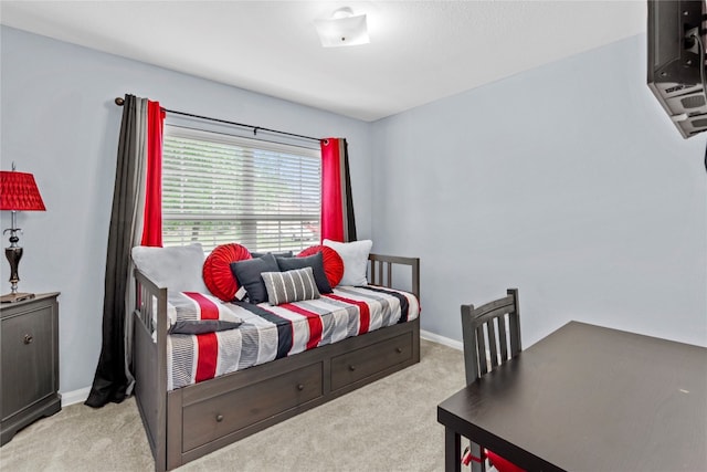 bedroom featuring light carpet