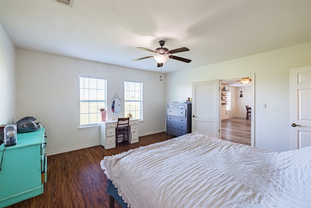 bedroom with ceiling fan and dark wood-type flooring