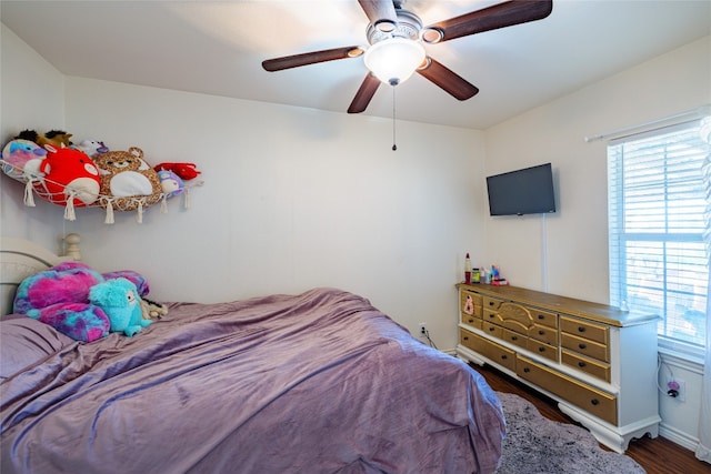 bedroom with hardwood / wood-style flooring and ceiling fan