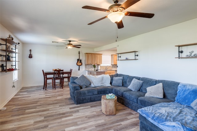 living room featuring light hardwood / wood-style flooring and sink