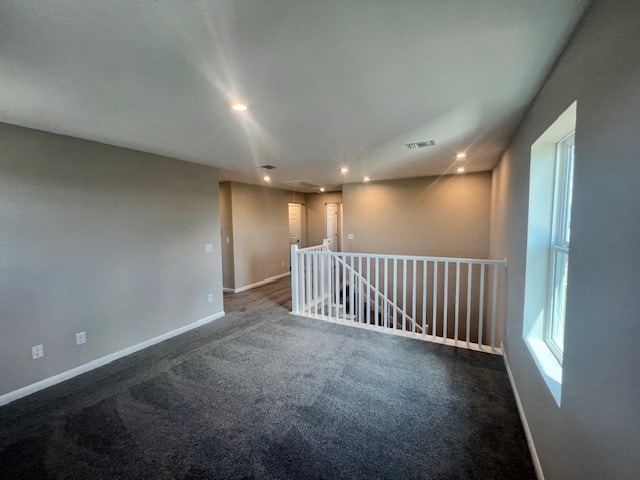 unfurnished room featuring carpet flooring