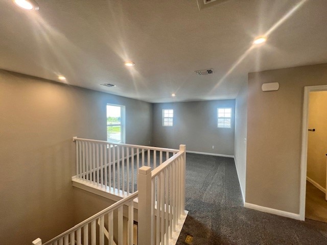 hall with carpet floors