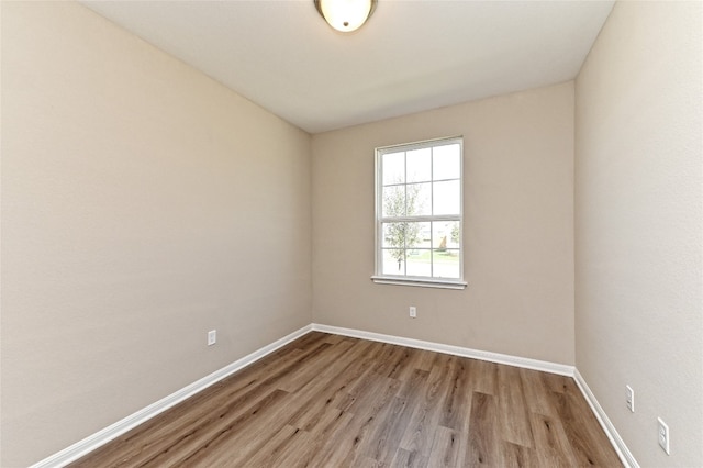 unfurnished room with light hardwood / wood-style flooring