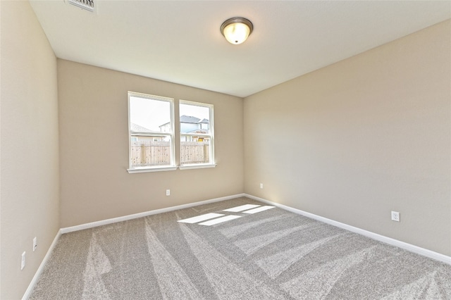 unfurnished room featuring carpet