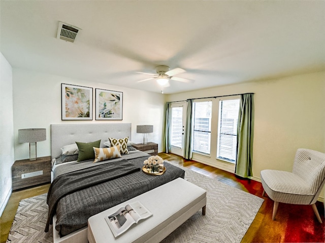 bedroom featuring ceiling fan, hardwood / wood-style flooring, and access to outside