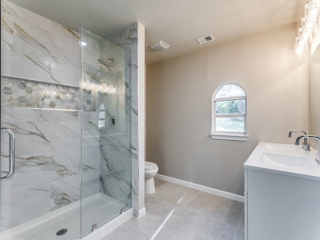 bathroom featuring walk in shower, tile flooring, toilet, and vanity