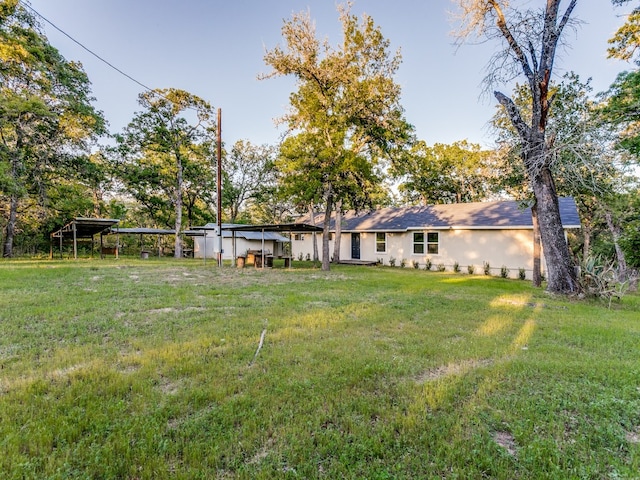 view of yard with a carport