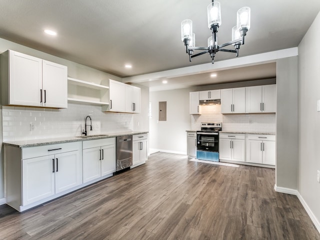 kitchen featuring dark hardwood / wood-style floors, stainless steel appliances, a chandelier, and white cabinetry