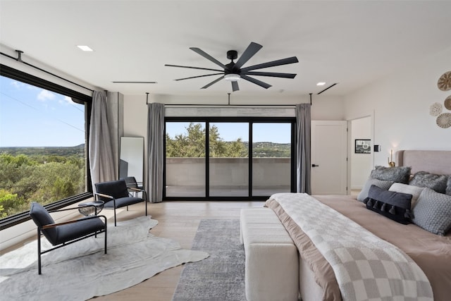 bedroom with ceiling fan, access to exterior, and light wood-type flooring