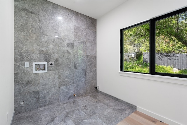 bathroom featuring hardwood / wood-style flooring and plenty of natural light