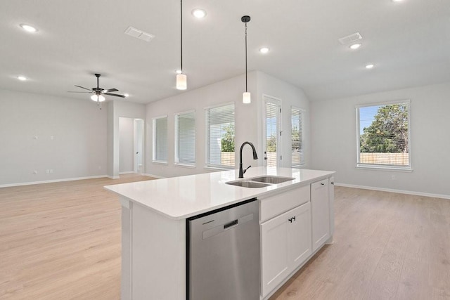 kitchen with a kitchen island with sink, pendant lighting, sink, white cabinetry, and stainless steel dishwasher