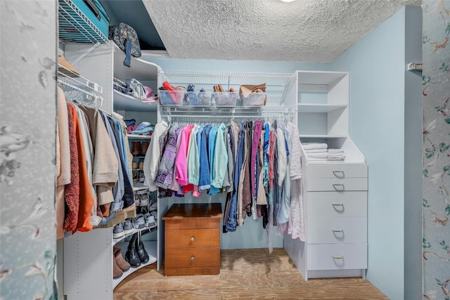 walk in closet featuring light wood-type flooring