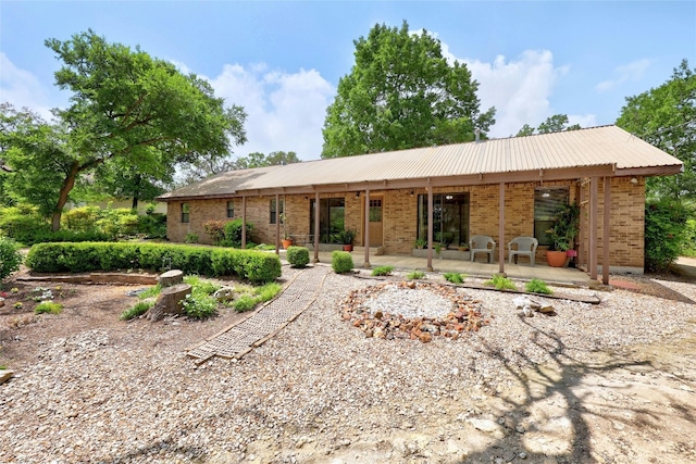 single story home featuring a patio