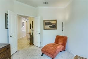 sitting room with light colored carpet