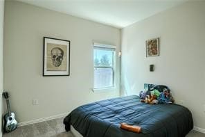 bedroom featuring light carpet