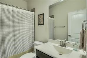 bathroom with toilet and vanity