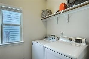 laundry area featuring washing machine and clothes dryer