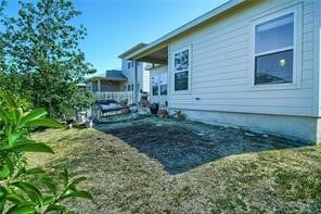 view of side of property featuring a yard