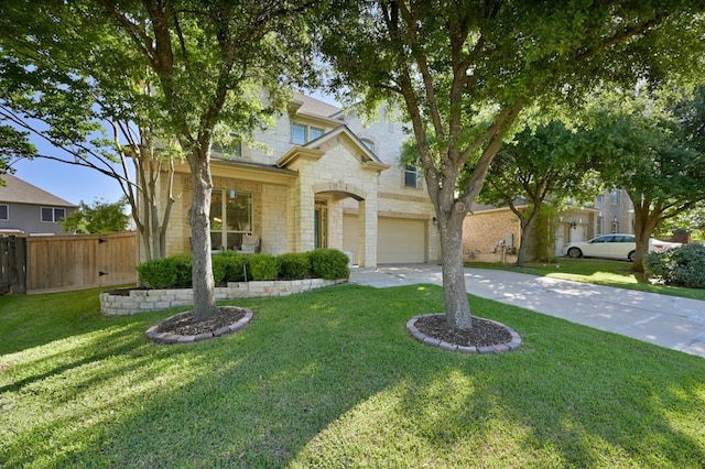 view of front of home featuring a front yard and a garage