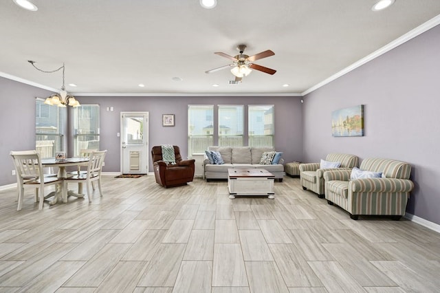 living room featuring crown molding and ceiling fan with notable chandelier