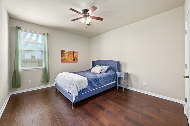 bedroom featuring ceiling fan and dark wood-type flooring