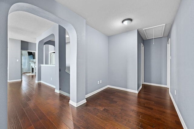 spare room featuring dark hardwood / wood-style flooring