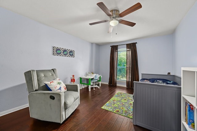 bedroom with dark hardwood / wood-style floors and ceiling fan