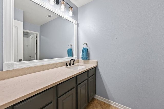 bathroom with vanity and tile patterned floors