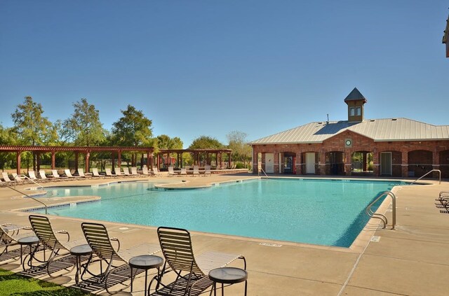 view of swimming pool featuring a patio