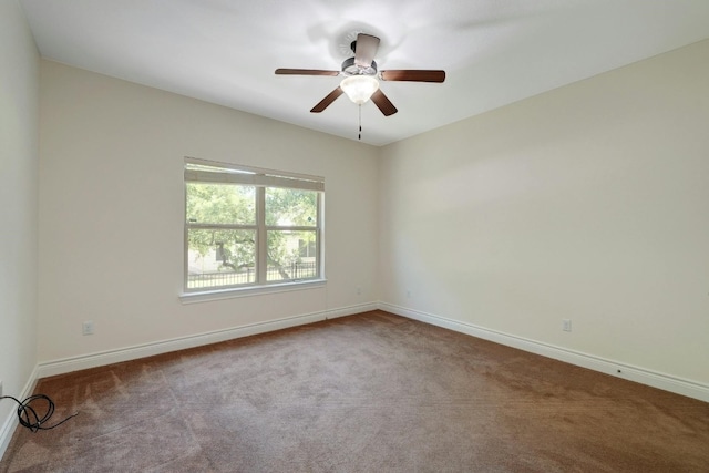 spare room with carpet flooring and ceiling fan